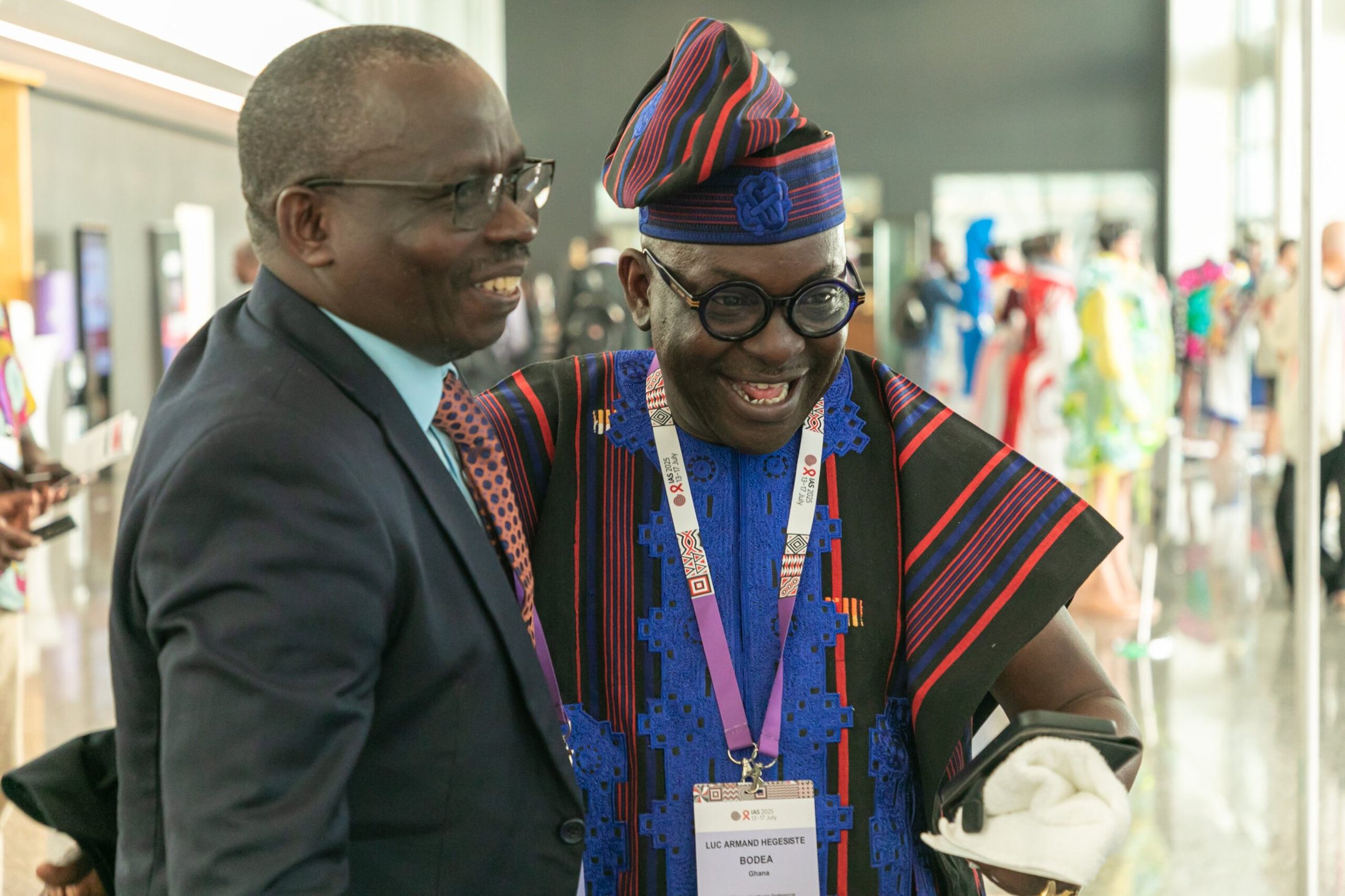 Delegates greet one another in traditional dress at ICASA, Africa's flagship HIV conference